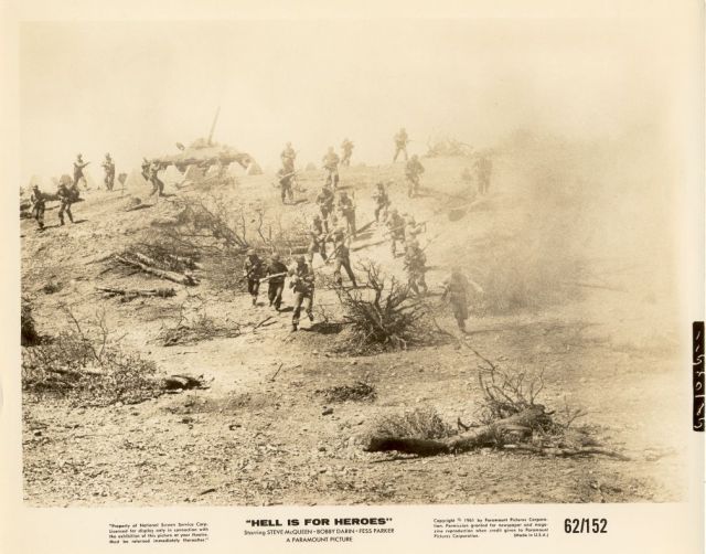 Long shot of US forces attacking the enemy stronghold.